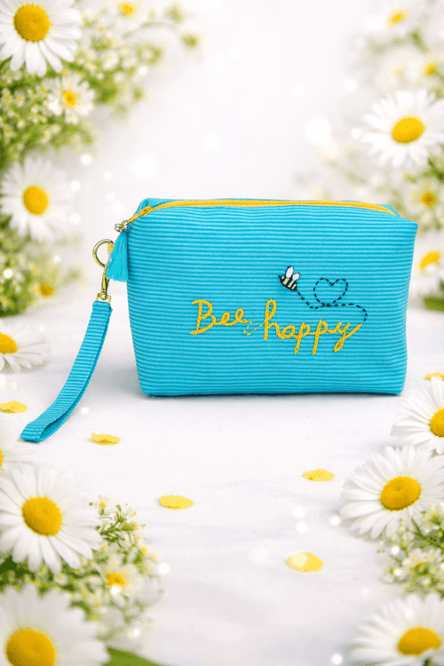 Artisan turquoise blue striped pouch bag with an on-off gold chain strap, featuring yellow 'Bee happy' embroidery and a stitched bumblebee by Thread & Dreams.⁠