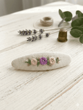 "Hand-embroidered hair clip on white linen with dusty pink roses and pearl details — Thread & Dreams"